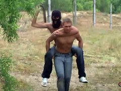 Hunky ponyboy urged with the help of heavy belt carries his master on his back around a vast field